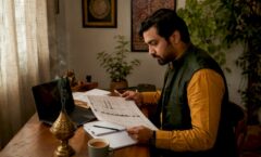 Event organizer reviewing world music festival schedule