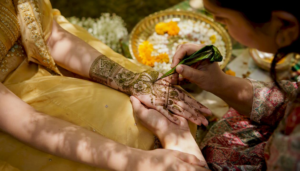 Henna application on bride's hands