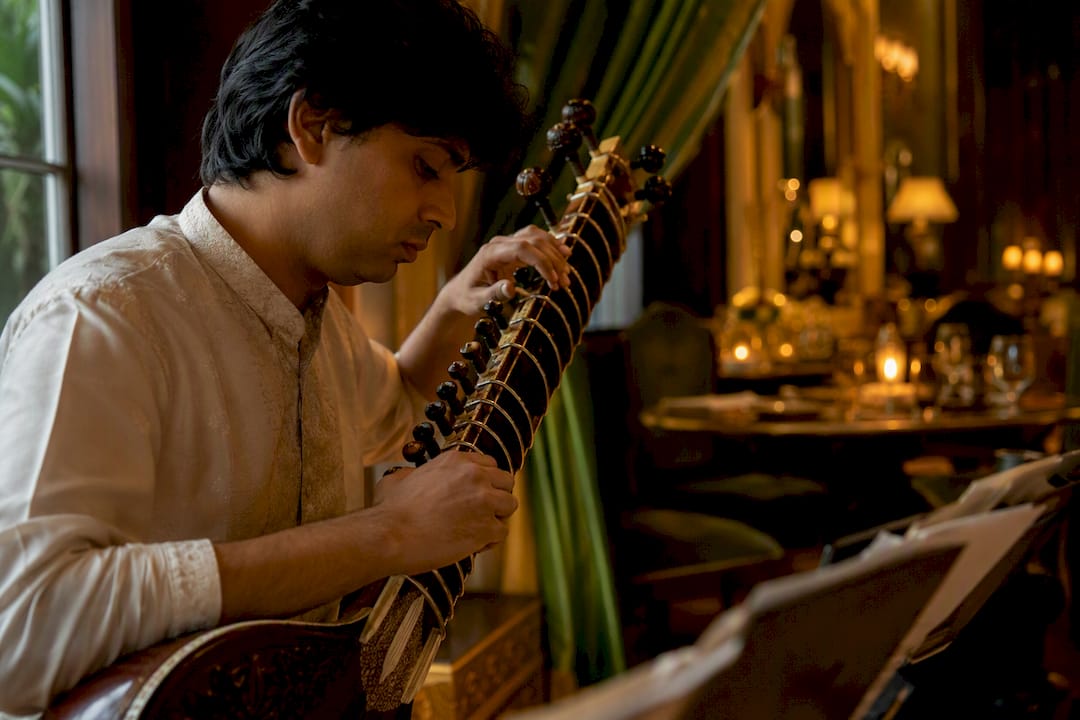 Rajib Karmakar sitarrajib Gala Dinner Music: How to Hire Sitar & Ensembles 1 Sitarist tuning sitar strings in gala venue