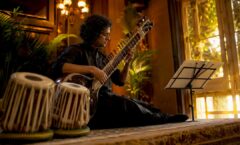 Sitarist performing live at cultural event