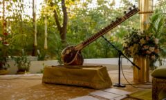 Sitar on stand with microphone at ceremony venue