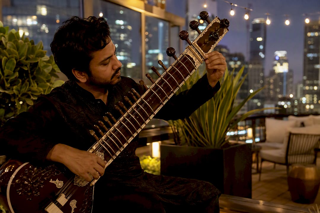 Sitar tuning and DJ mixing at reception venue