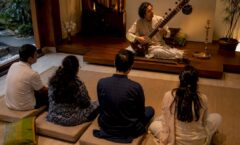 Learners practicing in an Indian music workshop