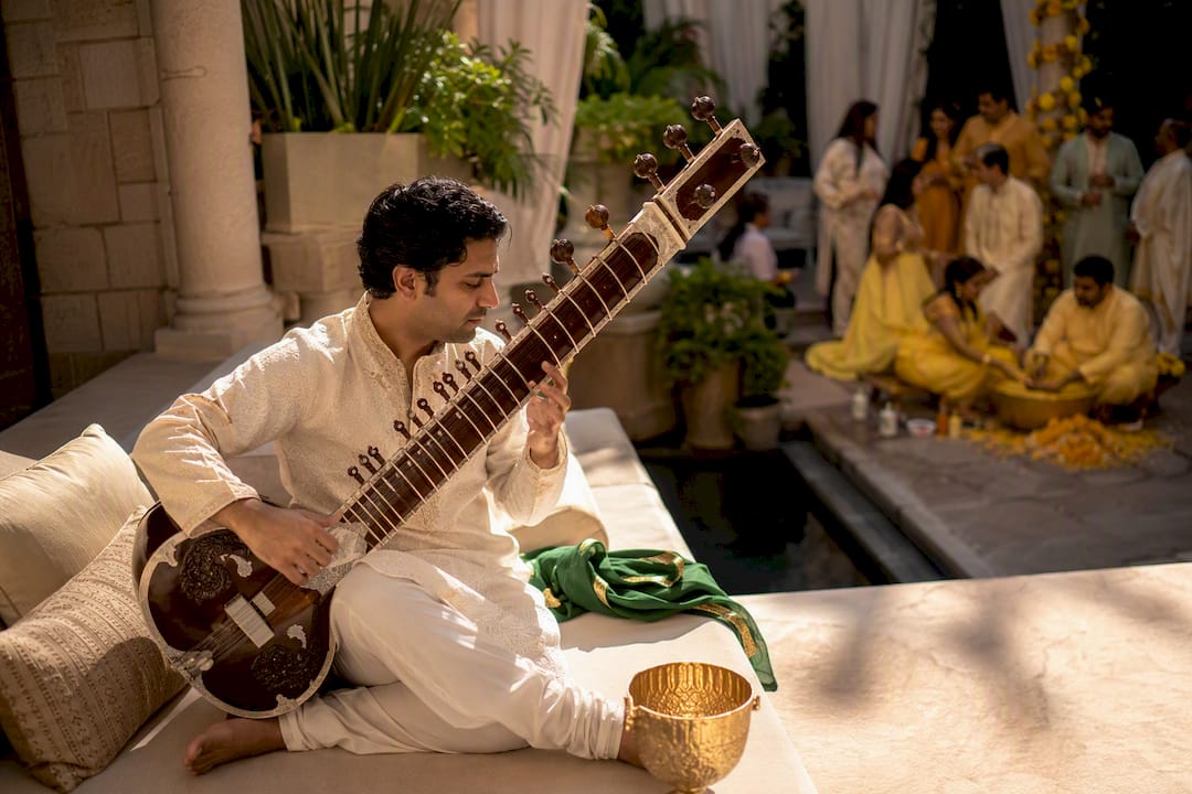 Sitarist performing at a Haldi ceremony