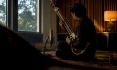 Composer recording original sitar launch music